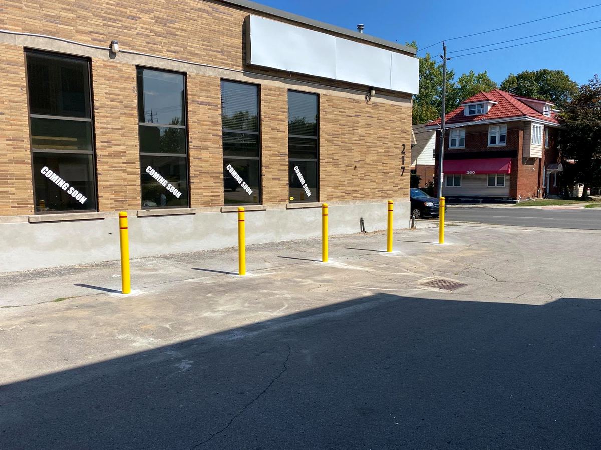 Commercial lot with new safety bollards installed