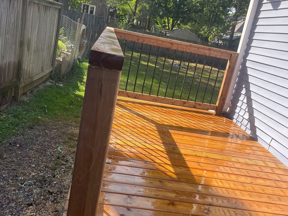 Freshly stained and sealed cedar deck, close view