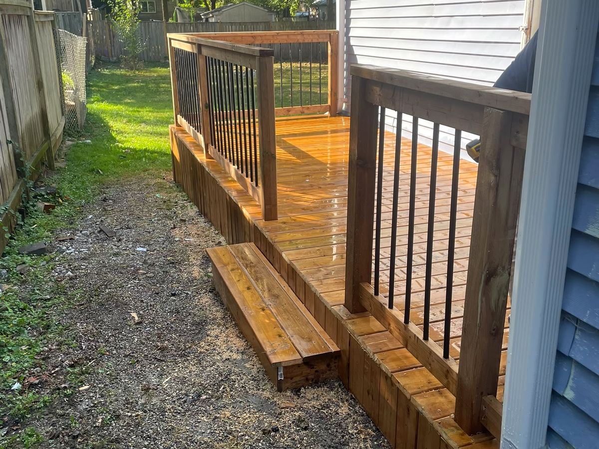 New cedar deck with black aluminum spindles